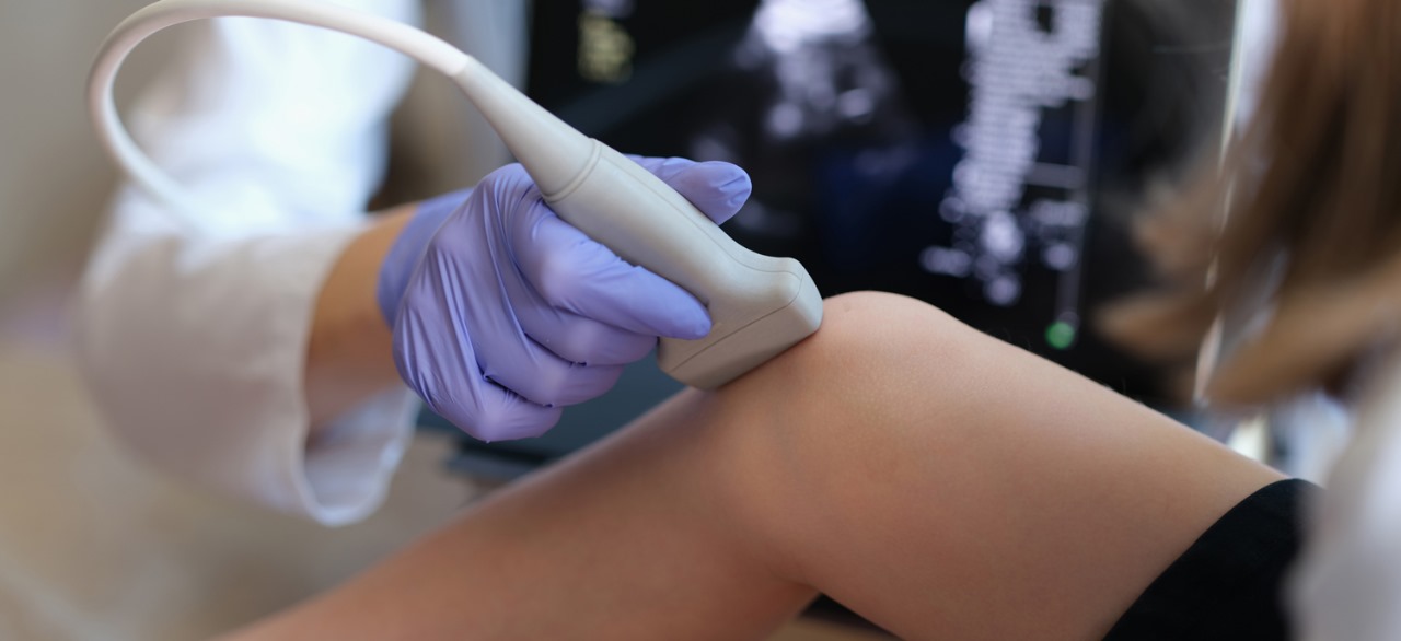 Clinician performing a diagnostic ultrasound scan